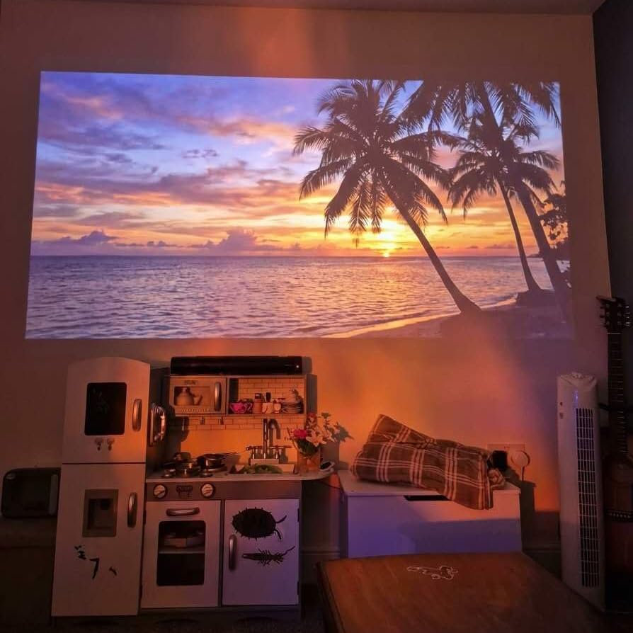Smart Projector [Google TV Built-in & 4K Support] with WiFi and Bluetooth, Portable Mini Movie Short Throw Projector Outdoor with Built-in Apps Auto Focus Keystone for Home Theater Bedroom Ceiling customer photo 1