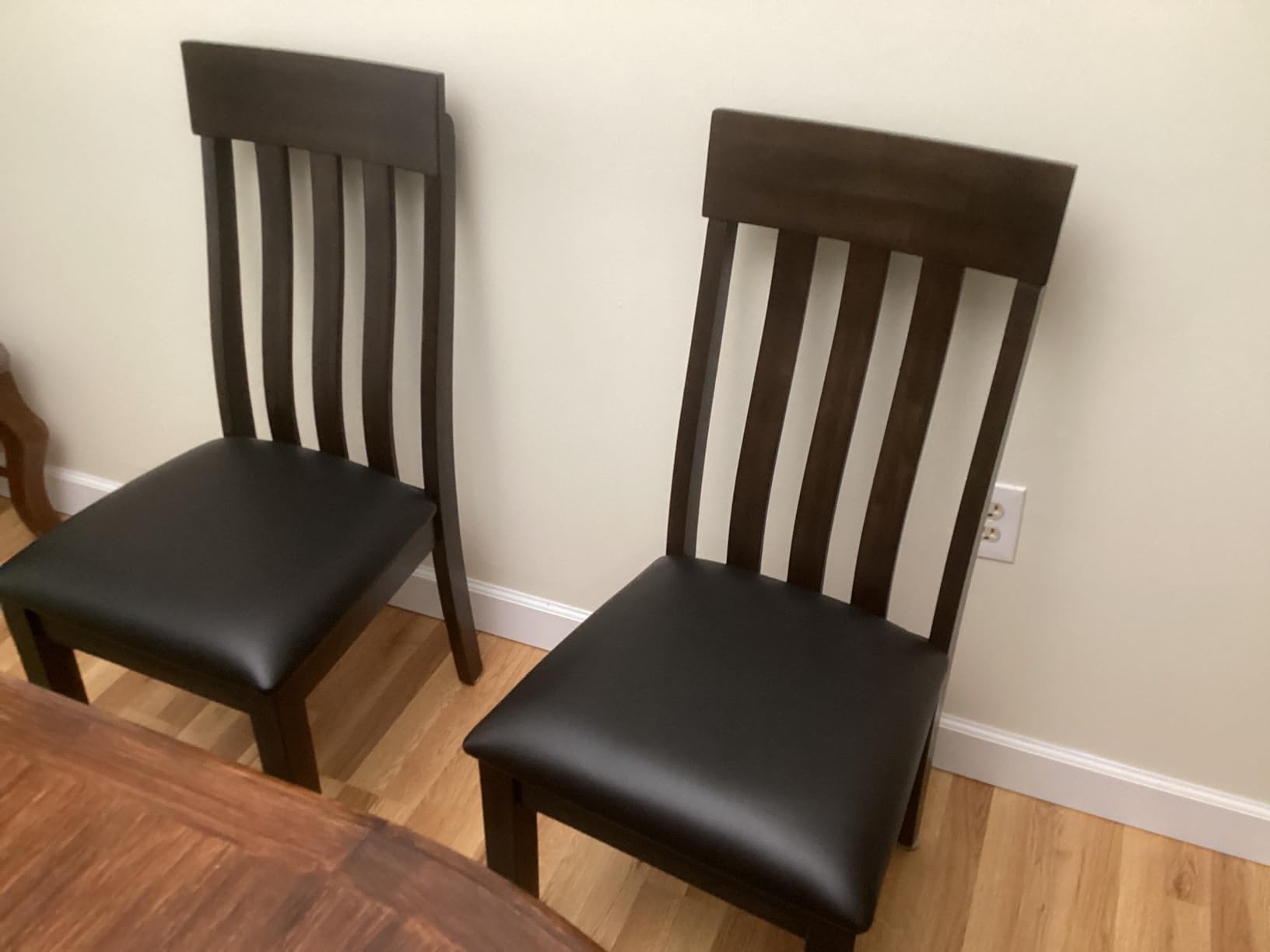 Signature Design by Ashley Haddigan Faux Leather Cushioned Rake Back Dining Chair, 2 Count, Dark Brown | Easy-to-clean faux leather upholstery, Wood frame and construction, Supportive rake-back design customer photo 1