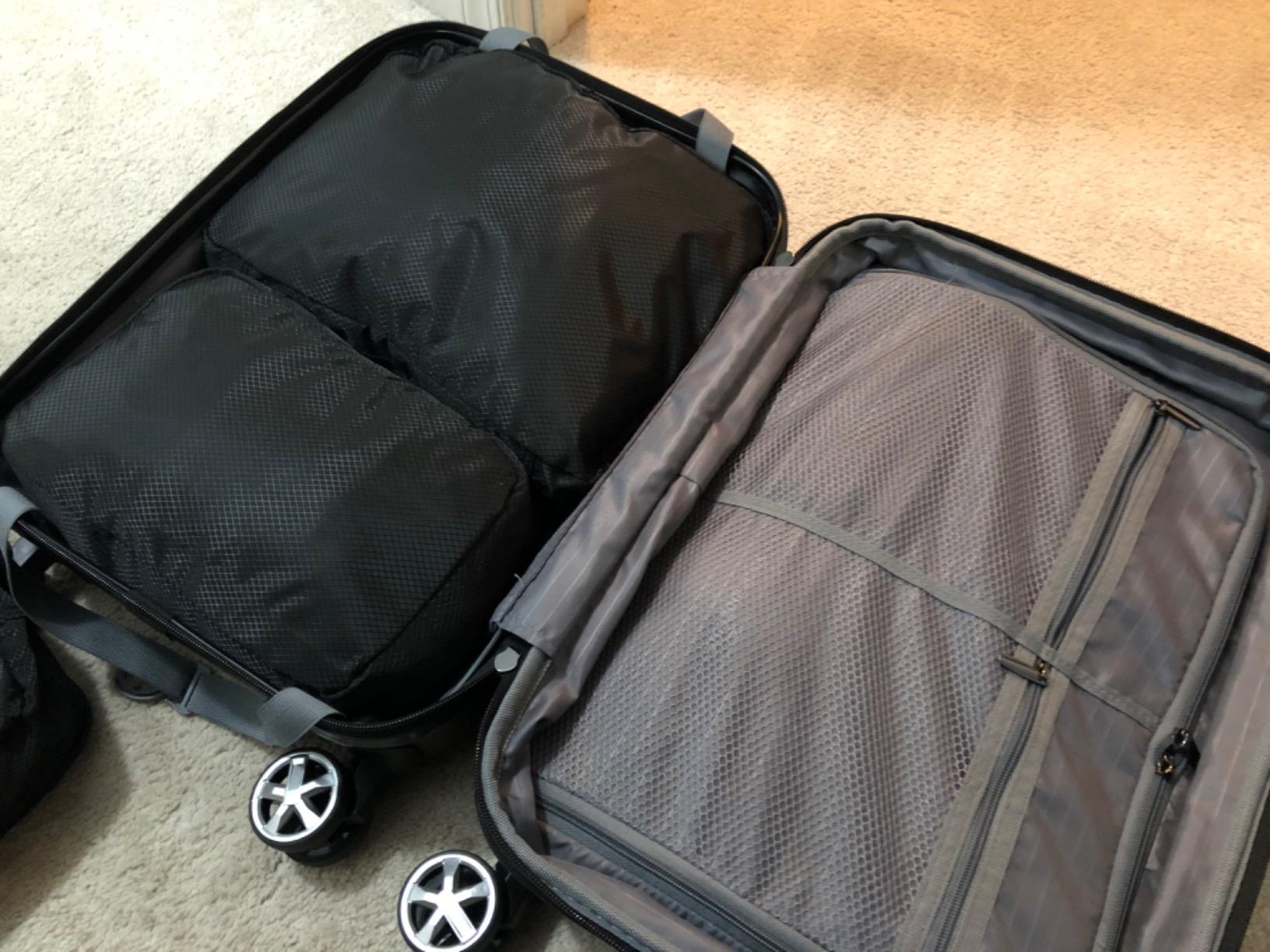 Amazon Basics 30-Inch Hardside Checked Spinner Luggage With TSA Lock, Lightweight Expandable Suitcase, Scratch-Resistant Surface, 8 Multi-directional Wheels, Black customer photo 2