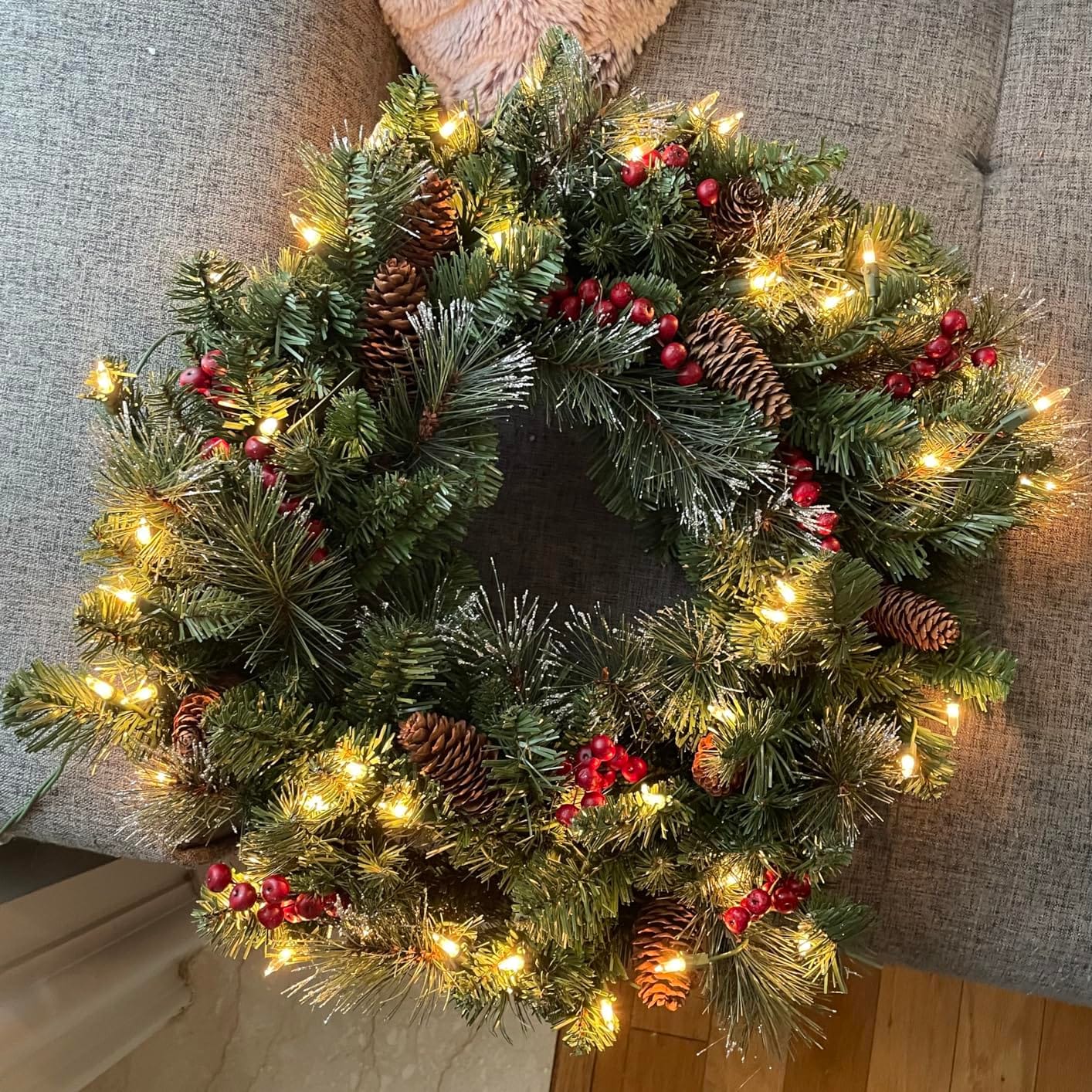 National Tree Company 24in Pre-Lit Crestwood Spruce Christmas Wreath | 50 Clear Lights, 160 Tips, Artificial Christmas Decoration with Glitter, Pinecones, Red Berries, Green customer photo 1