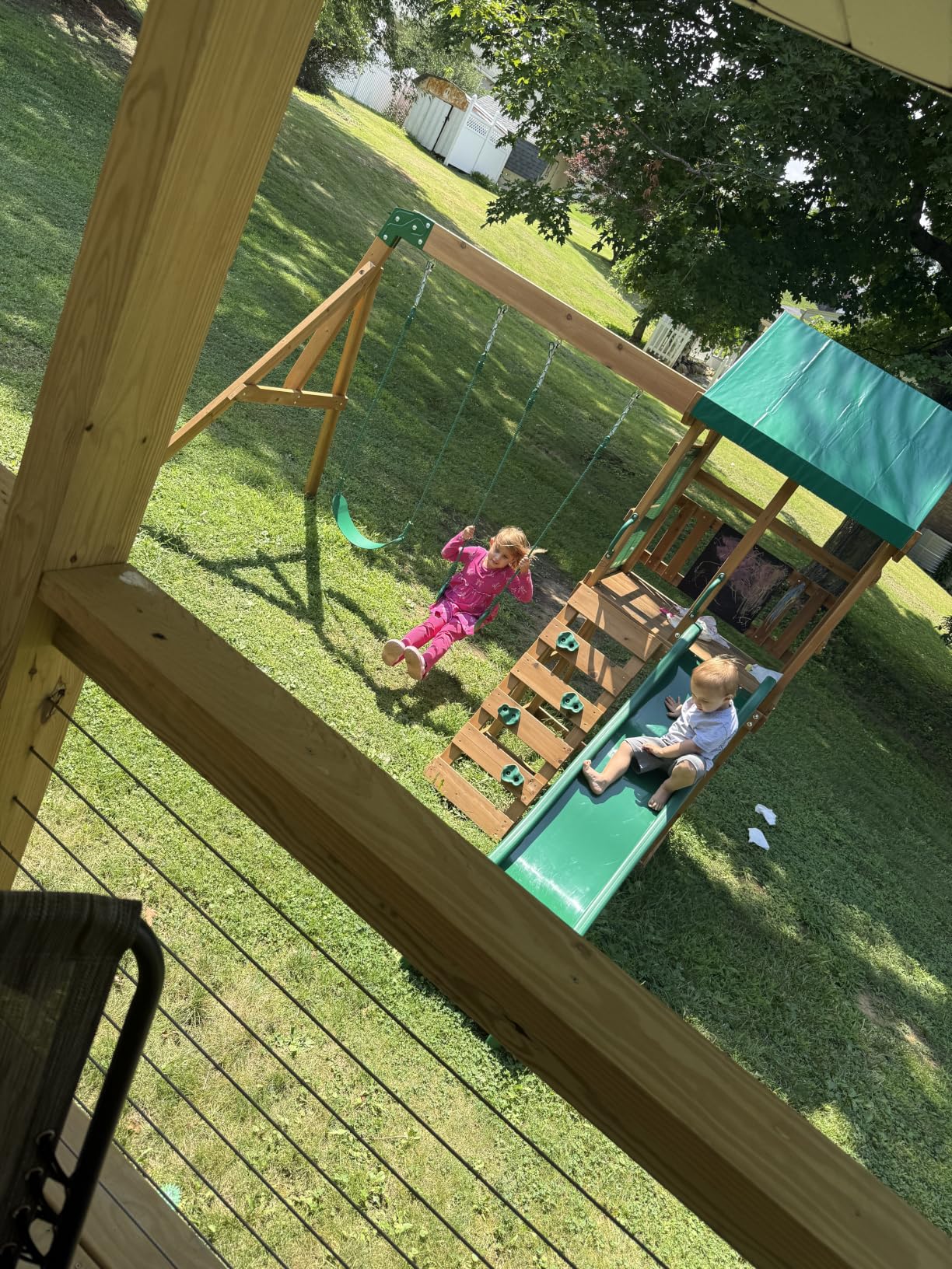 Backyard Discovery Buckley Hill Cedar Wood Swing Set with Wave Slide, Play Deck, Rock Wall Ladder, Belt Swings, Chalkboard, Canopy Roof, Outdoor Playset customer photo 1