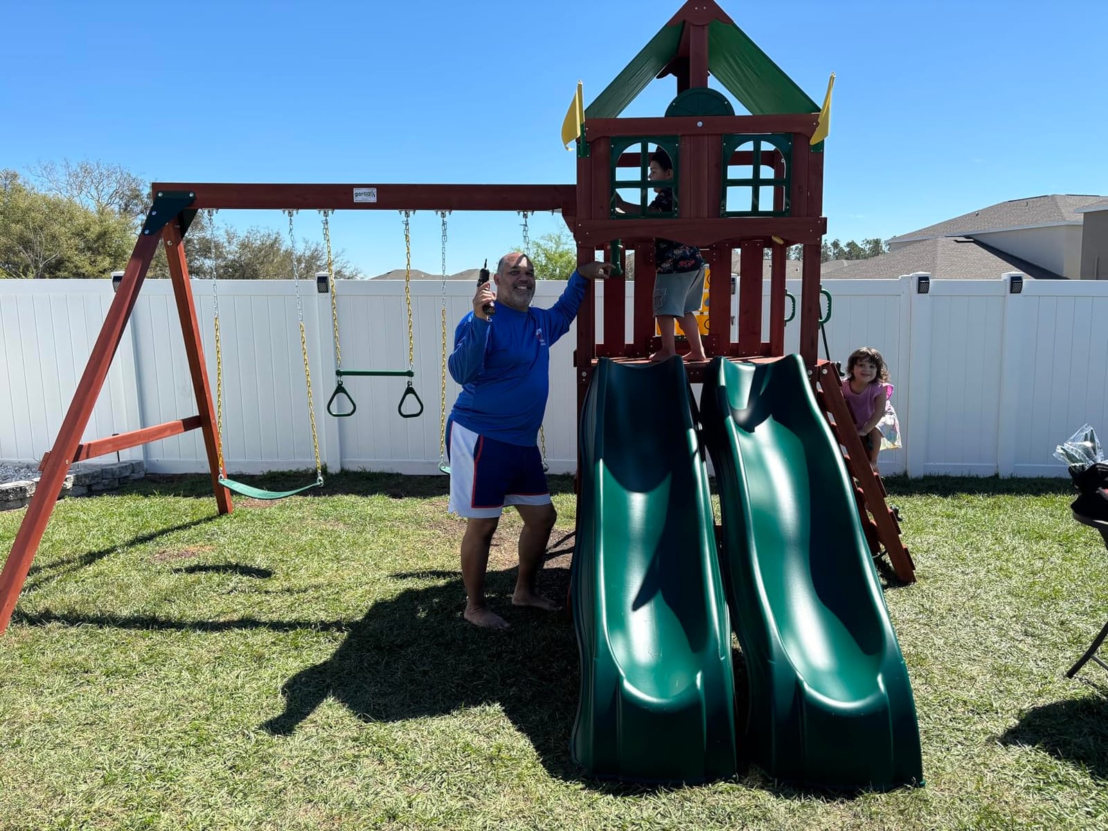 Gorilla Playsets Playmaker Deluxe Wooden Swing Set with Vinyl Canopy Roof, Dual Wave Slides, and Rock Climbing Wall, Redwood Stained Cedar customer photo 2