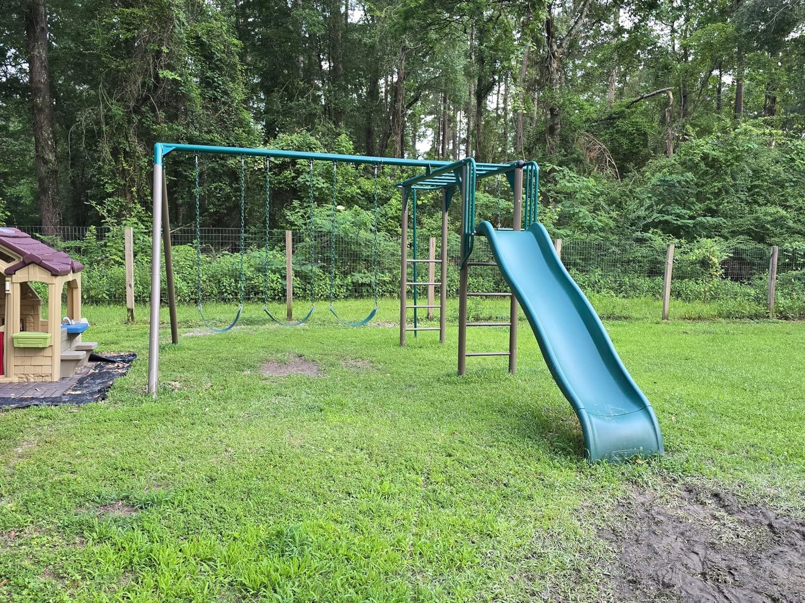 Lifetime 91028 Monkey Bar Adventure Swing Set with 3 Swings, Trapeze Bar, 9-Foot Slide and Fireman's Pole, Earthtone customer photo 1