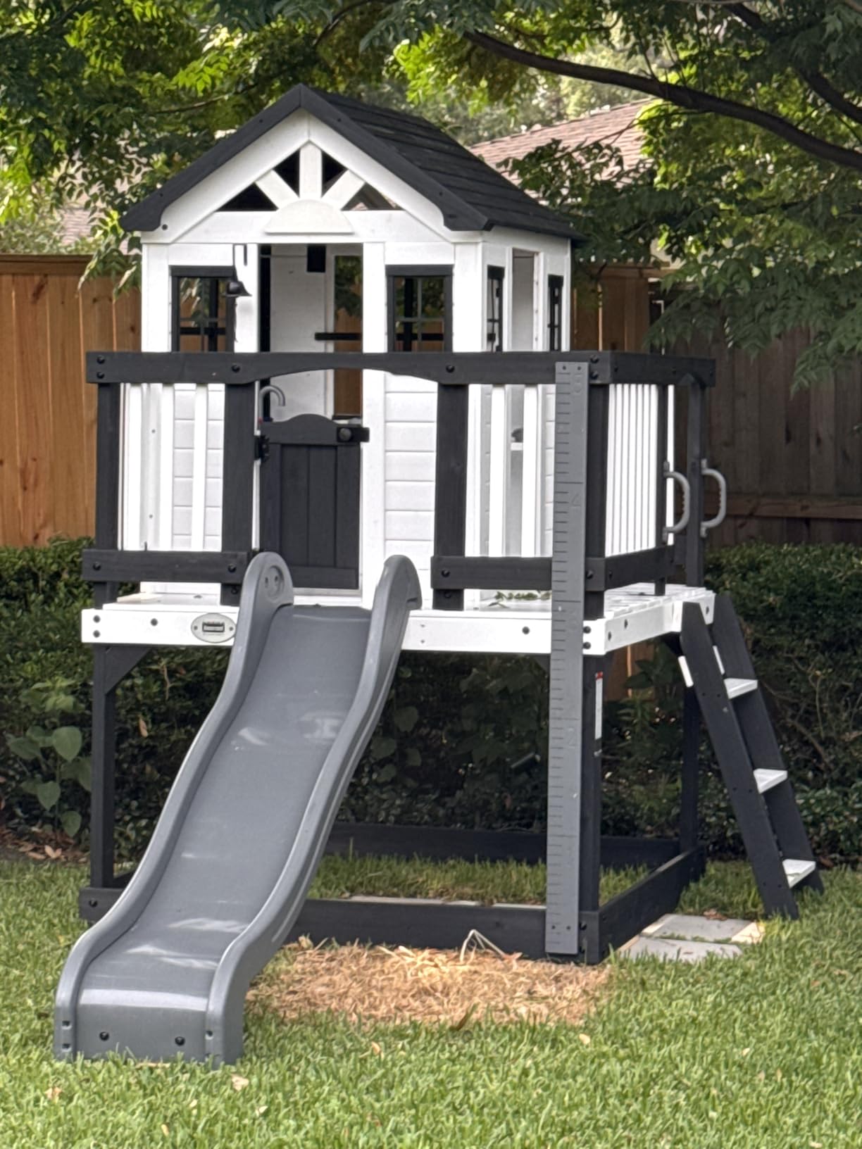 Backyard Discovery Echo Heights Elevated Cedar Wooden Kids Playhouse with Wave Slide, Play Kitchen, Wrap-Around Deck, Flat-Step Ladder, Half Door, Windows, Bell, and Growth Chart for Outdoor Play customer photo 2