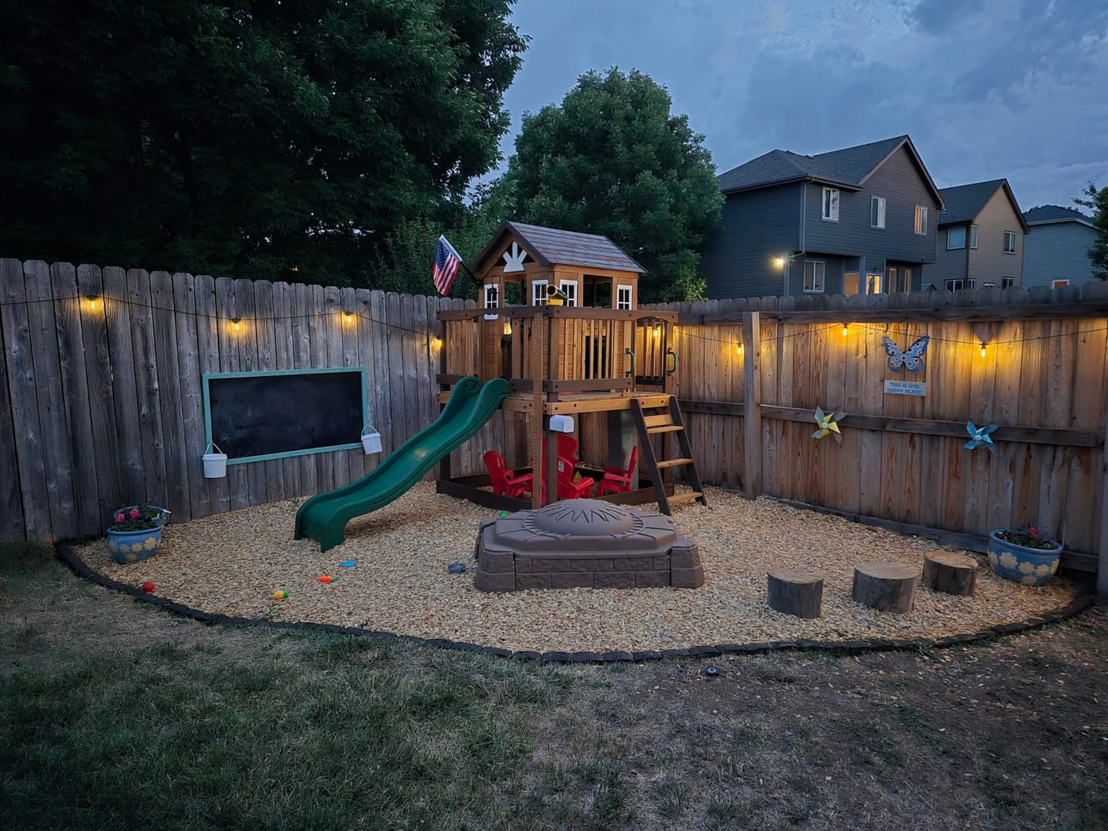 Backyard Discovery Beacon Heights Elevated Cedar Wooden Kids Playhouse with Wave Slide, Play Kitchen, Wrap-Around Deck, Flat-Step Ladder, Half Door, Windows, Bell, and Growth Chart for Outdoor Play customer photo 1