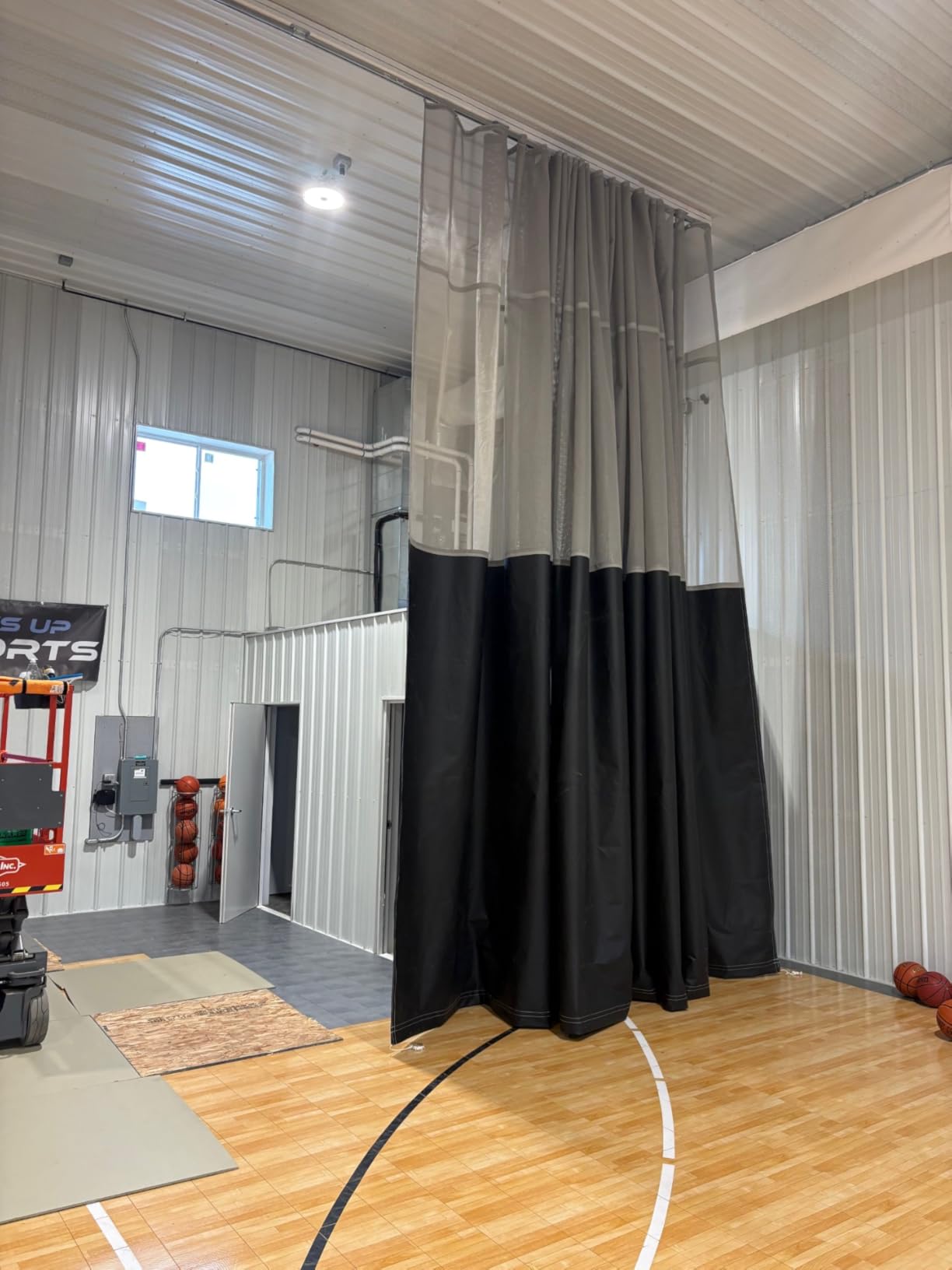 Akon Gym Divider Curtains with Track, Custom Vinyl or Mesh Panels | Rolling gym divider panels for quickly partitioning fitness, school, and sports areas. Custom sizes with track hardware. customer photo 1