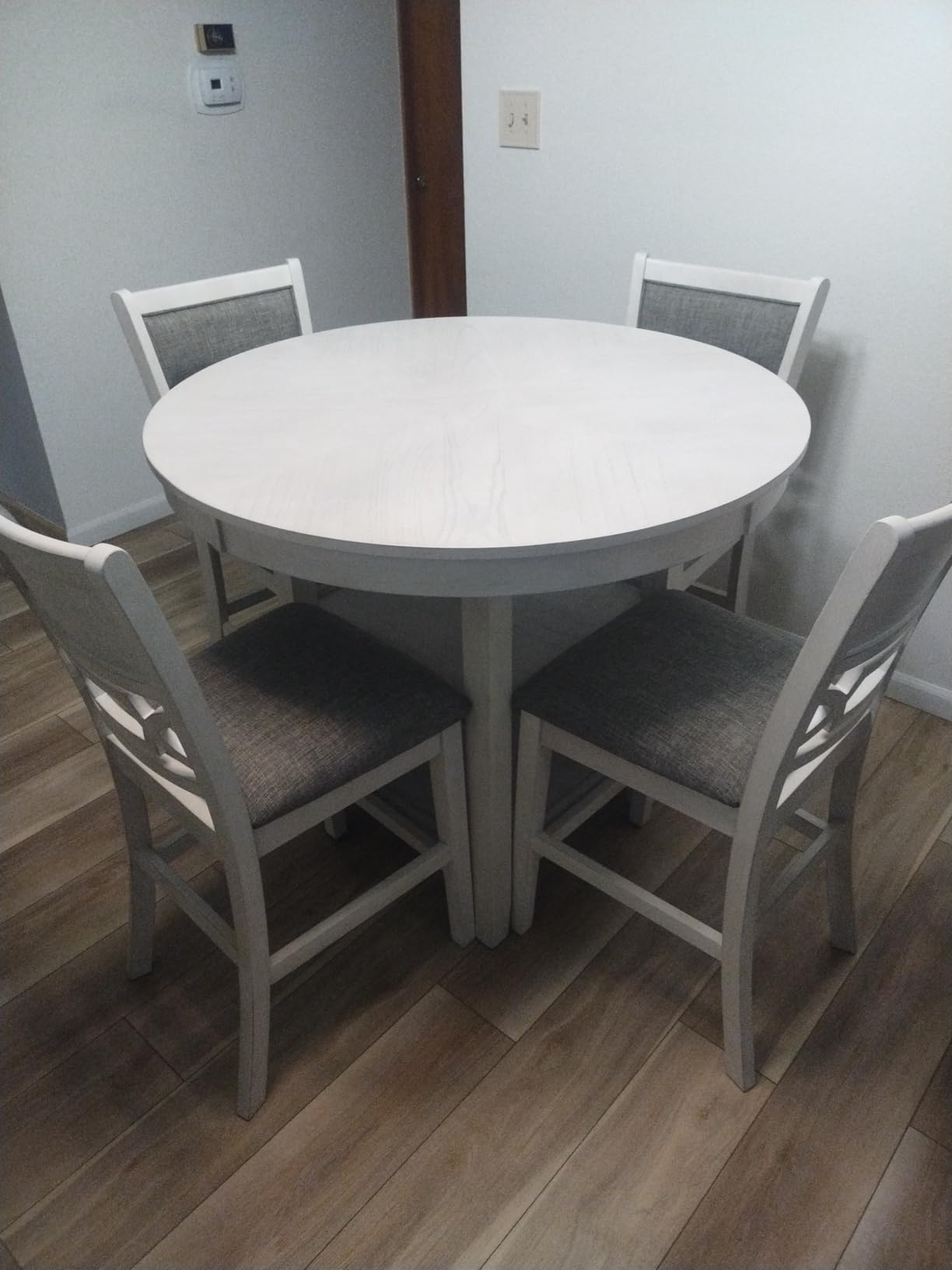 Signature Design by Ashley 5-Piece Round Counter Height Dining Set, Gray | 42-inch round dining table with 2 storage shelves, 4 upholstered bar stools, Wrenning Series customer photo 1