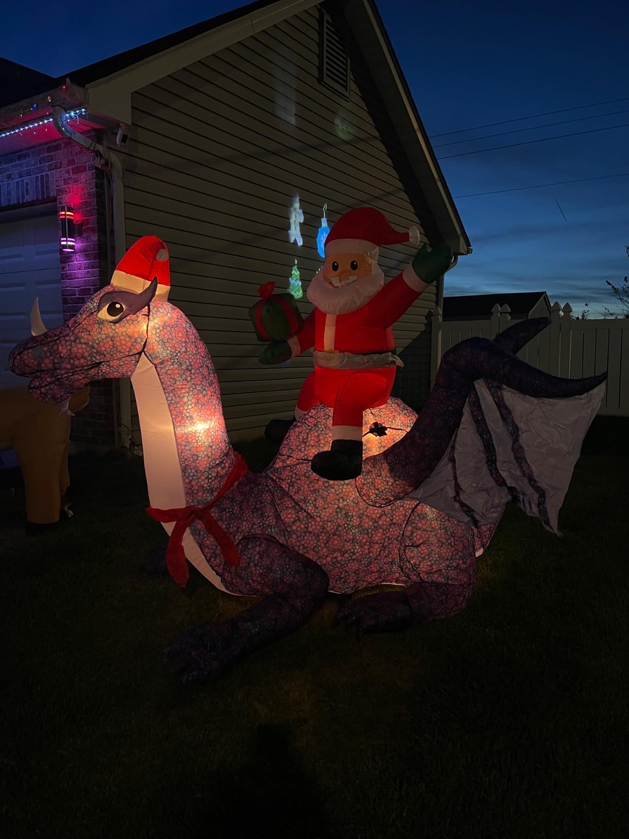 Gemmy Animated Inflatable Christmas Santa Riding Dragon, 6 ft Tall, Multi customer photo 1