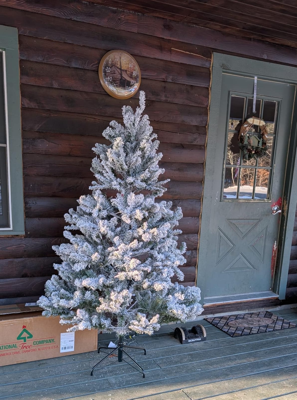 National Tree Company 7.5 ft Pre-Lit Flocked Acacia Artificial Christmas Tree, 550 Clear Lights, 1,300 Branch Tips, Includes Stand, Green customer photo 1